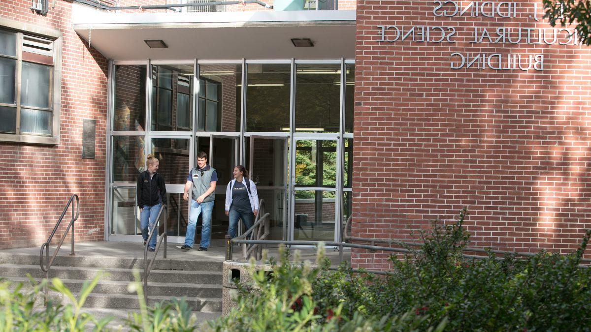 two students exiting the CALS building.